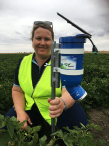 CSIRO's Dr Rose Brodrick with a prototype WaterWise sensor in tomatoes.